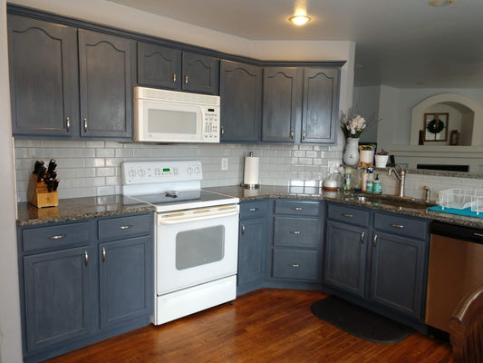 Charcoal grey blue chalk painted kitchen cabinets