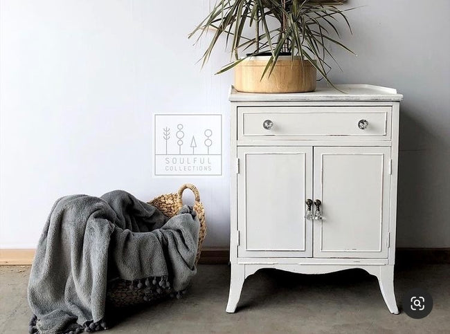 Side Table cabinet painted off white with subtle distressing and blanket basket