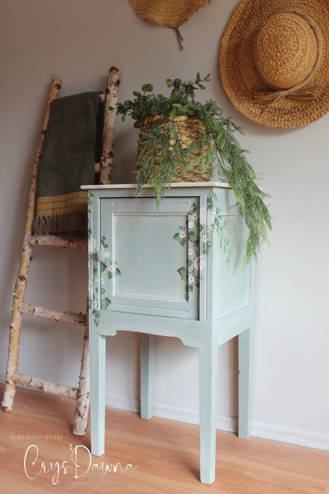 Mint green painted cabinet table with blanket ladder