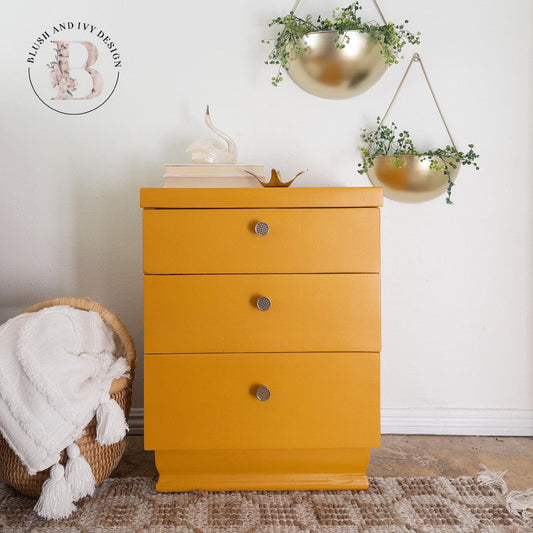 Mustard yellow painted dresser with gold waffle pattern knobs