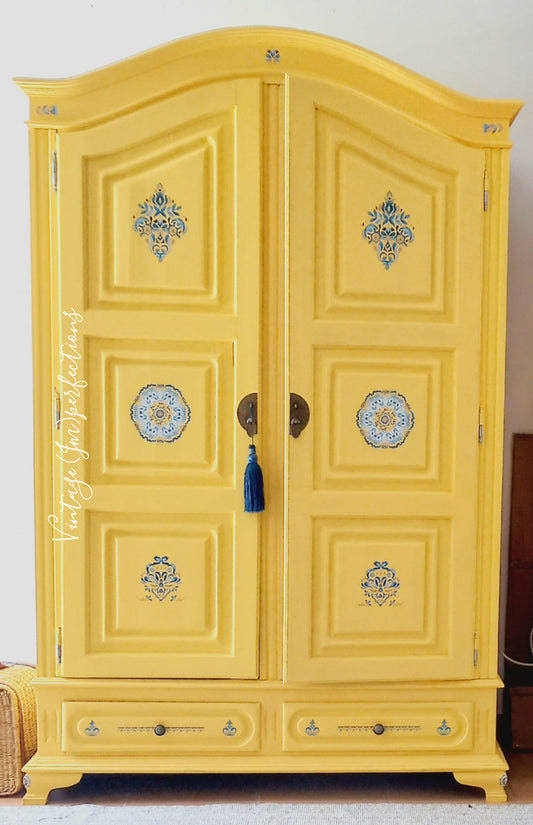 Bohemian armoire wardrobe painted yellow with stencil details