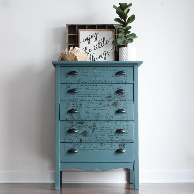 tall dresser in Jitterbug black cup pulls framed photo potted plant