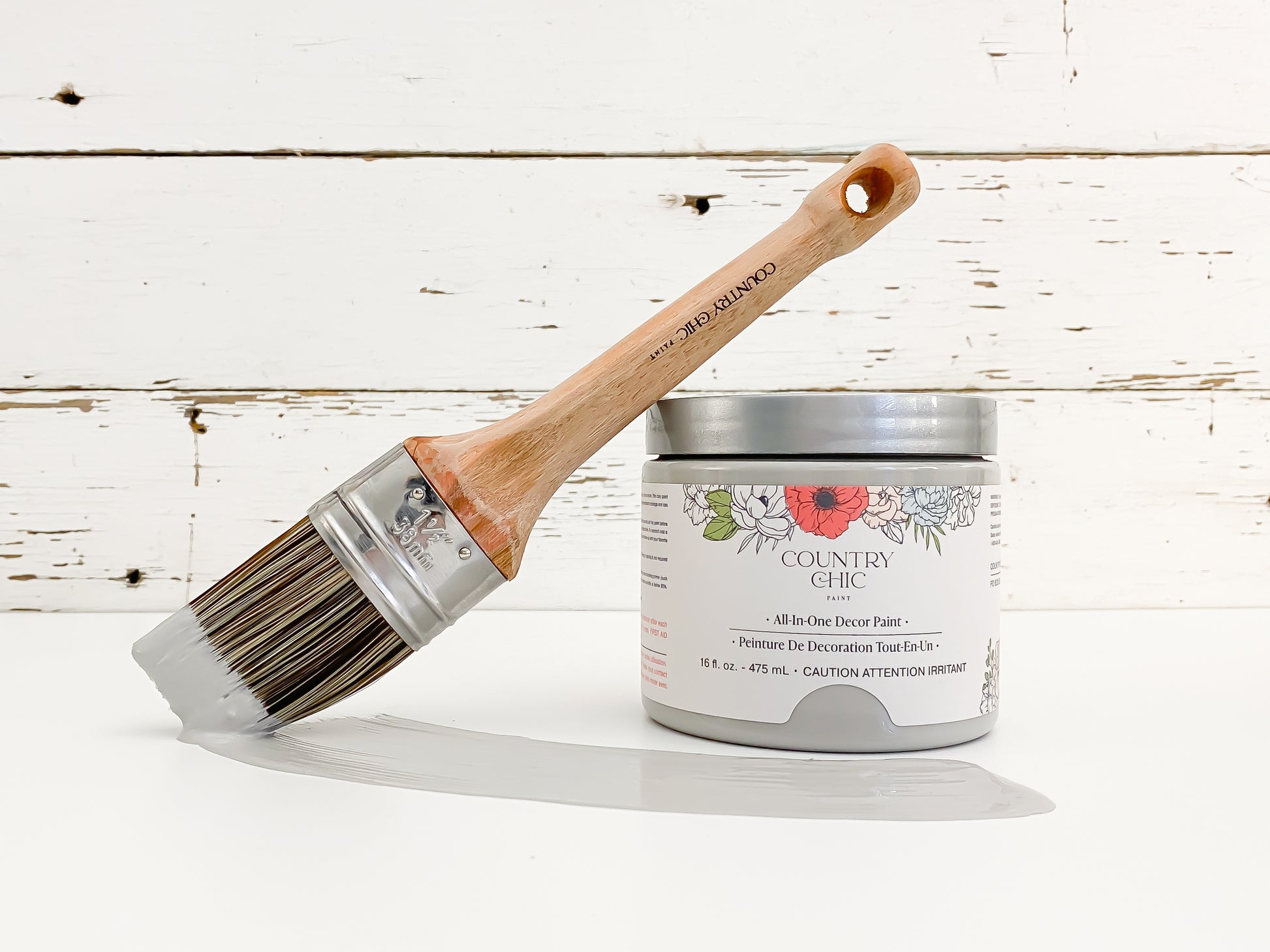 16oz jar of Country Chic Chalk Style All-In-One Paint in the color Pebble Beach. Mid-tone grey.