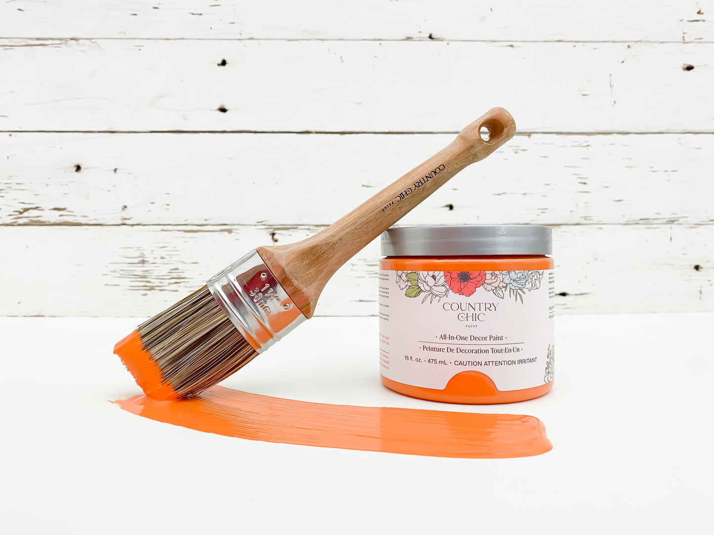 16oz jar of Country Chic Chalk Style All-In-One Paint in the color Persimmon. Citrus orange.