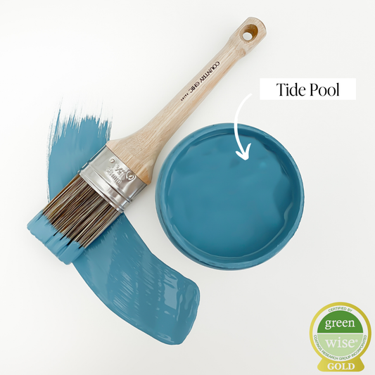 Top view of an open 16oz jar of Country Chic Chalk Style All-In-One Paint in the color Tide Pool. Tealish-ocean blue.