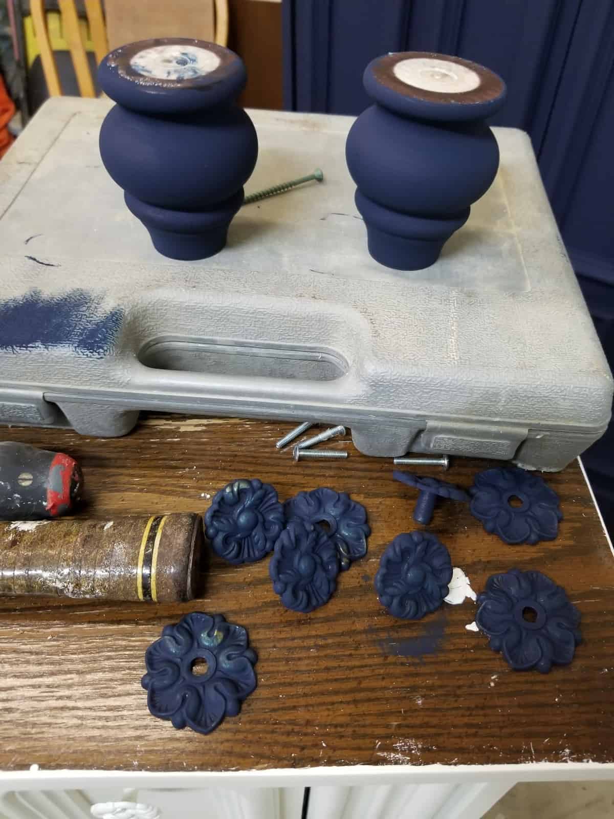 Navy blue painted bun feet and hardware for painted wardrobe makeover with eco-friendly furniture paint in the color, Peacoat by Country Chic Paint
